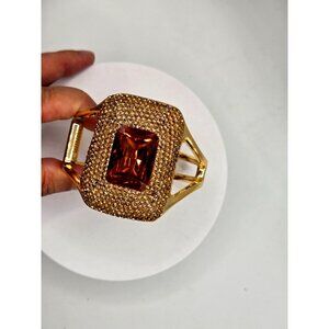 Clamper Bracelet with Amber color stone and rhinestones gold tone